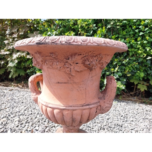 13 - Pair of moulded terracotta lattice urns ivy leaf decoration {56 cm H x 46 cm Dia.}.