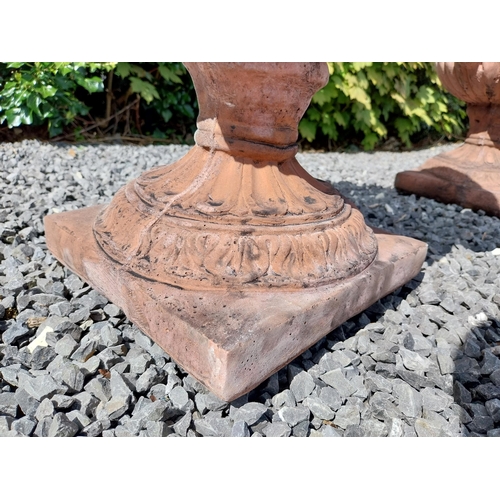 13 - Pair of moulded terracotta lattice urns ivy leaf decoration {56 cm H x 46 cm Dia.}.