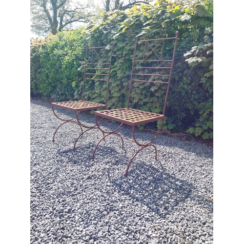 154 - Pair of wrought iron high back garden chairs {114 cm H x 44 cm W x 44 cm D}.