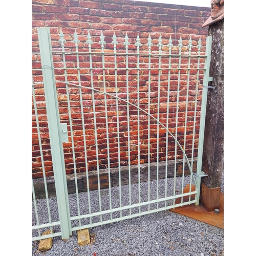 156 - Pair of wrought iron entrance gates decorated with spire finials {195 cm H x 325 cm W}.