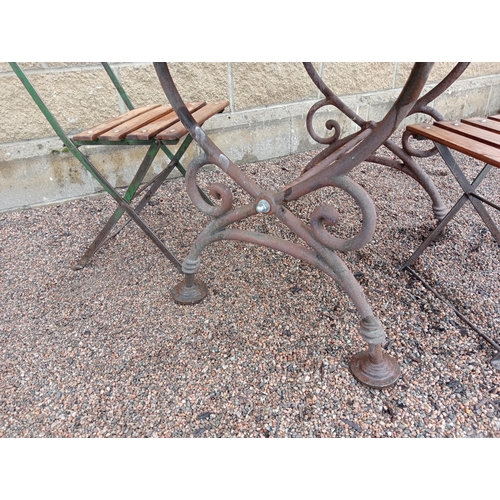 163 - Cast iron table marble top with two folding metal and wooden bistro chairs {Table H 70cm x W 106cm x... 