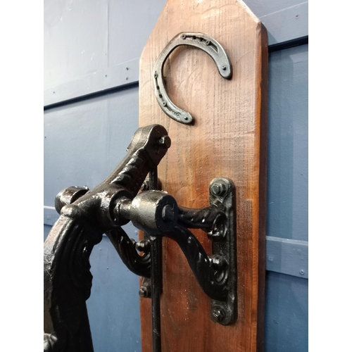 171 - Ornate cast iron water pump mounted on wooden board{H 133cm x W 36cm x D 41cm }. (NOT AVAILABLE TO V... 