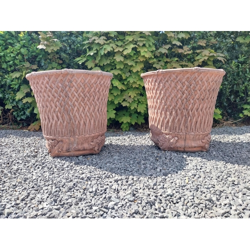 174 - Pair of moulded terracotta circular lattice urns {53 cm H x 54 cm Dia.}.