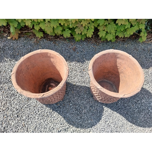 174 - Pair of moulded terracotta circular lattice urns {53 cm H x 54 cm Dia.}.