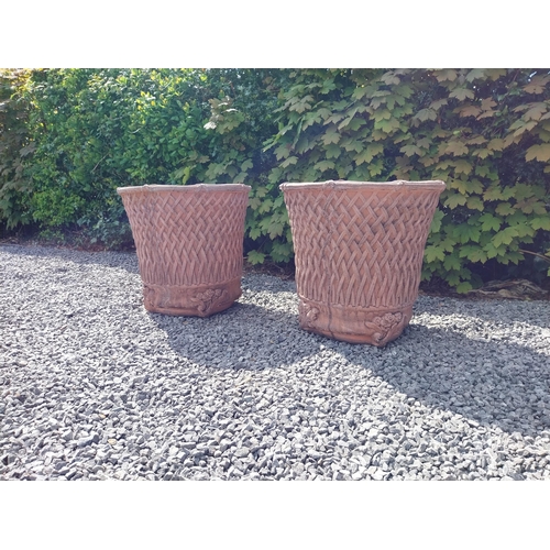 174 - Pair of moulded terracotta circular lattice urns {53 cm H x 54 cm Dia.}.