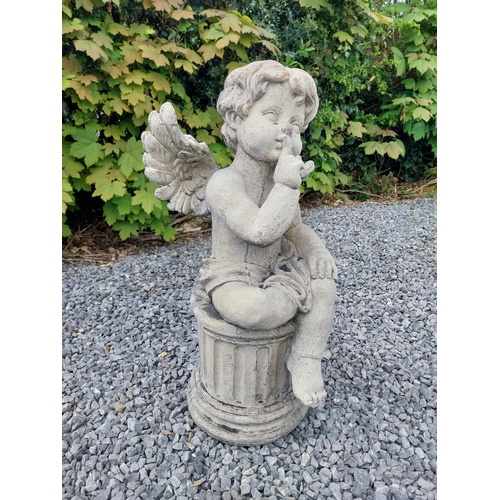 184 - Moulded stone figure of a winged Cherub {58 cm H x 31 cm W x 23 cm D}.