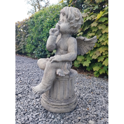 184 - Moulded stone figure of a winged Cherub {58 cm H x 31 cm W x 23 cm D}.