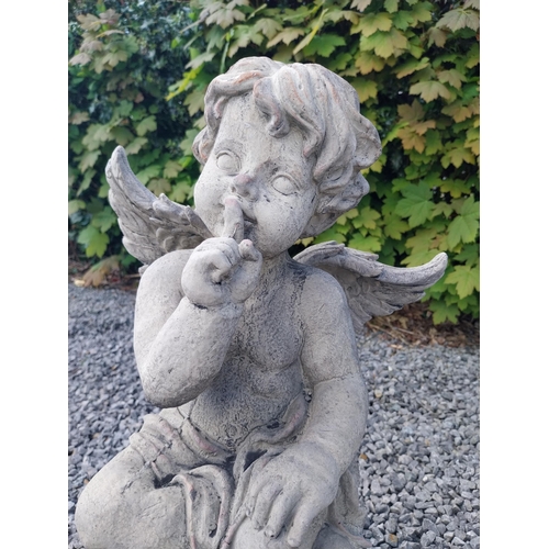 184 - Moulded stone figure of a winged Cherub {58 cm H x 31 cm W x 23 cm D}.