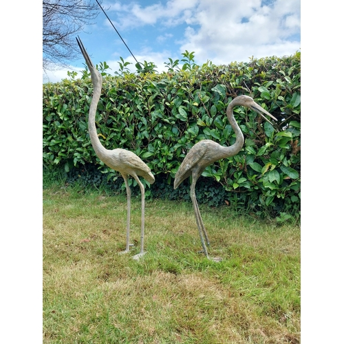 186 - Two bronze statues of Storks {120 cm H x 18 cm W x 53 cm D and 89 cm H x 18 cm W x 56 cm D}.