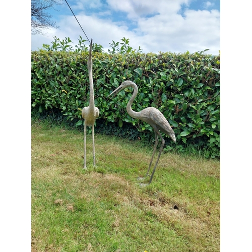 186 - Two bronze statues of Storks {120 cm H x 18 cm W x 53 cm D and 89 cm H x 18 cm W x 56 cm D}.