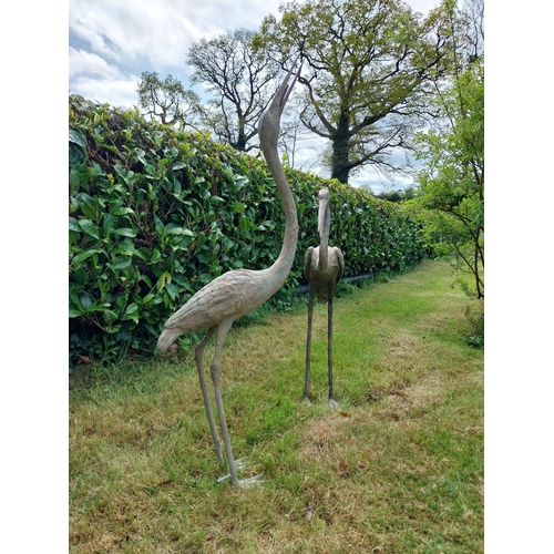 186 - Two bronze statues of Storks {120 cm H x 18 cm W x 53 cm D and 89 cm H x 18 cm W x 56 cm D}.