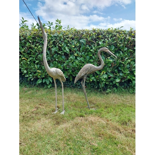 186 - Two bronze statues of Storks {120 cm H x 18 cm W x 53 cm D and 89 cm H x 18 cm W x 56 cm D}.