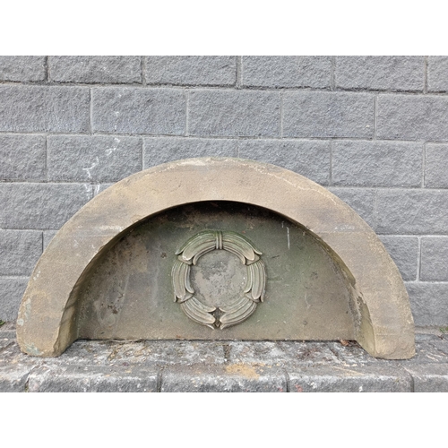 193 - Large semi circular stone surround top with decorative centre piece {H 79cm x W 154cm x D 34cm }. (N... 