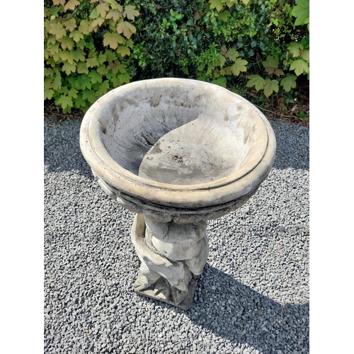 194 - Moulded stone bird bath held of loft by Cherub {91 cm H x 49 cm Dia.}.