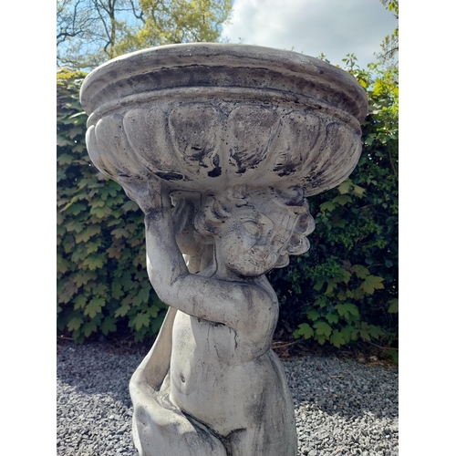 194 - Moulded stone bird bath held of loft by Cherub {91 cm H x 49 cm Dia.}.