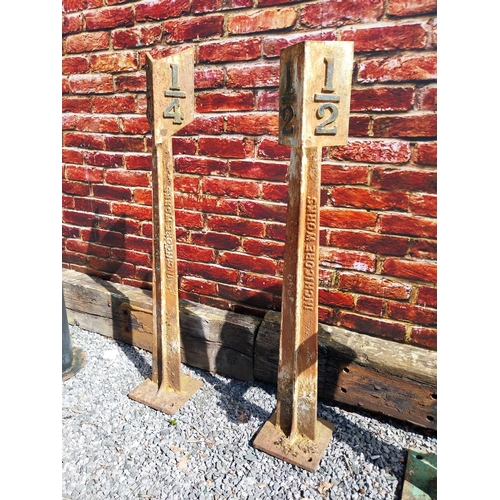 202 - Pair of cast iron 1/2 and 1/4 mile markers {133 cm H x 24 cm W x 24 cm D}.