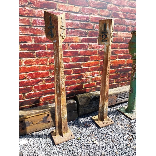 202 - Pair of cast iron 1/2 and 1/4 mile markers {133 cm H x 24 cm W x 24 cm D}.