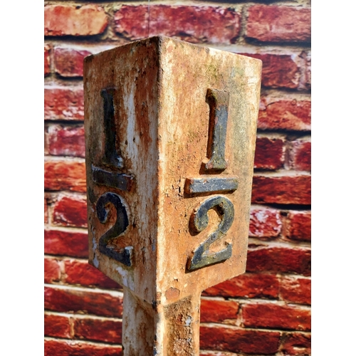 202 - Pair of cast iron 1/2 and 1/4 mile markers {133 cm H x 24 cm W x 24 cm D}.