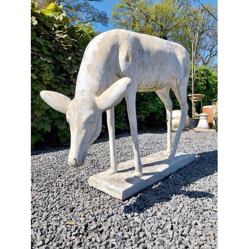 204 - Moulded stone statue of a Deer {88 cm H x 122 cm W x 77 cm D}.