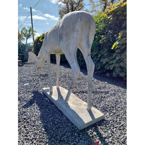 204 - Moulded stone statue of a Deer {88 cm H x 122 cm W x 77 cm D}.