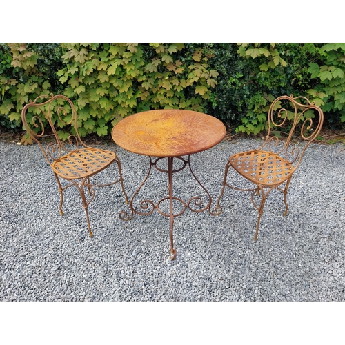 205 - Wrought iron caf� - garden circular table with two matching chairs {Tbl. 75 cm H x 70 cm Dia. Chairs... 