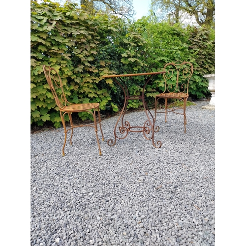 205 - Wrought iron caf� - garden circular table with two matching chairs {Tbl. 75 cm H x 70 cm Dia. Chairs... 