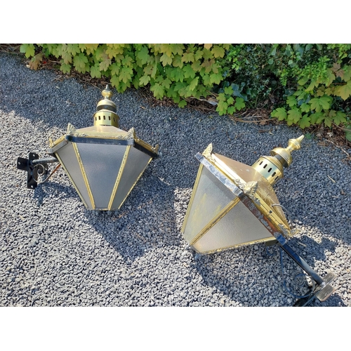 214 - Pair of brass wall lanterns with wrought iron brackets {79 cm H x 83 cm W x 60 cm D}.