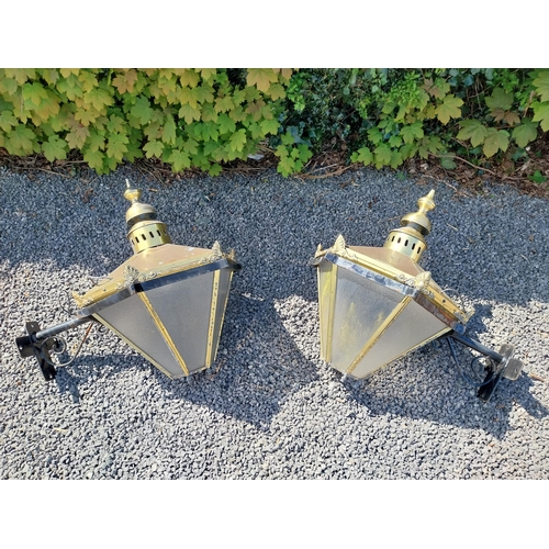 214 - Pair of brass wall lanterns with wrought iron brackets {79 cm H x 83 cm W x 60 cm D}.