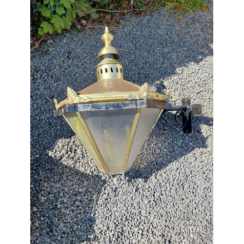 214 - Pair of brass wall lanterns with wrought iron brackets {79 cm H x 83 cm W x 60 cm D}.