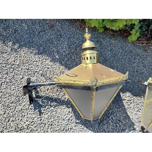 214 - Pair of brass wall lanterns with wrought iron brackets {79 cm H x 83 cm W x 60 cm D}.