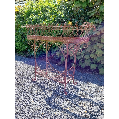 252 - Decorative wrought iron plant stand {86 cm H x 86 cm W x 20 cm D}.