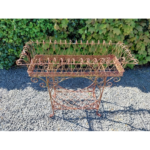 252 - Decorative wrought iron plant stand {86 cm H x 86 cm W x 20 cm D}.