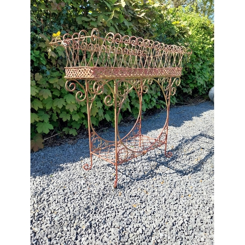 252 - Decorative wrought iron plant stand {86 cm H x 86 cm W x 20 cm D}.