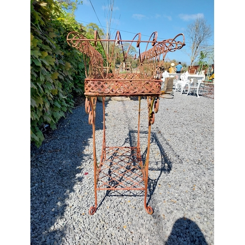 252 - Decorative wrought iron plant stand {86 cm H x 86 cm W x 20 cm D}.