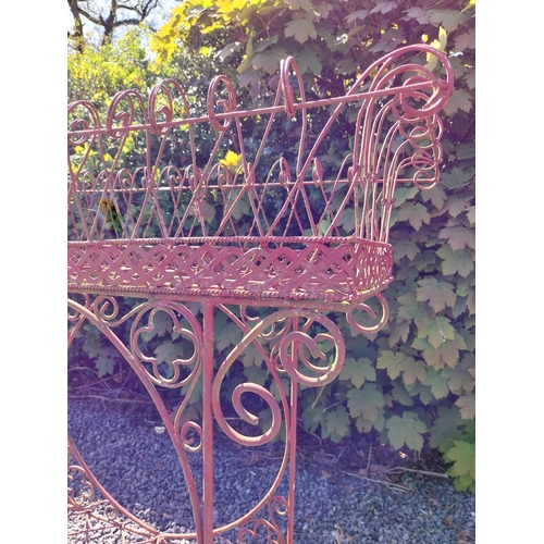 252 - Decorative wrought iron plant stand {86 cm H x 86 cm W x 20 cm D}.