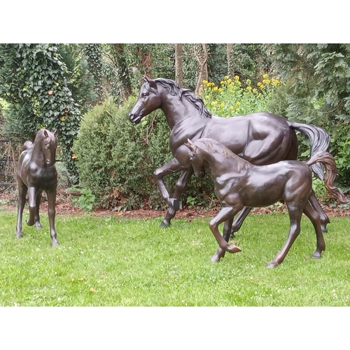 253 - Pair of bronze statues of foals {H 100cm x W 120cm x D 30cm}. (NOT AVAILABLE TO VIEW IN PERSON)