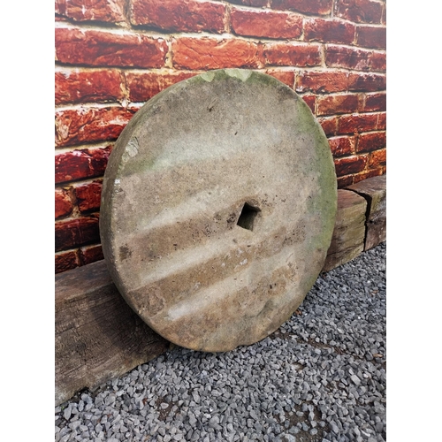 255 - Large 19th C. sandstone grinding stone {10 cm D x 71 cm Dia.}.