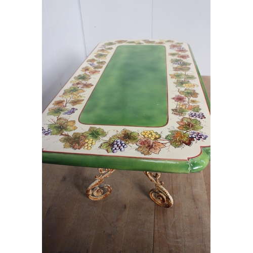 256 - Handmade and hand painted ceramic table raised on cast iron scroll base {H 79cm x W 200cm x D 92cm }... 