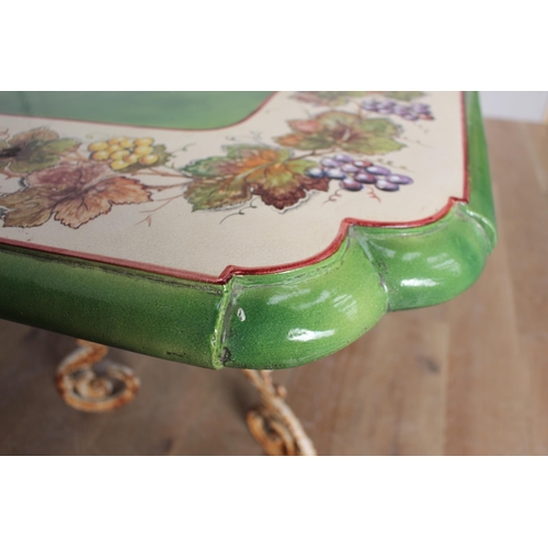 256 - Handmade and hand painted ceramic table raised on cast iron scroll base {H 79cm x W 200cm x D 92cm }... 