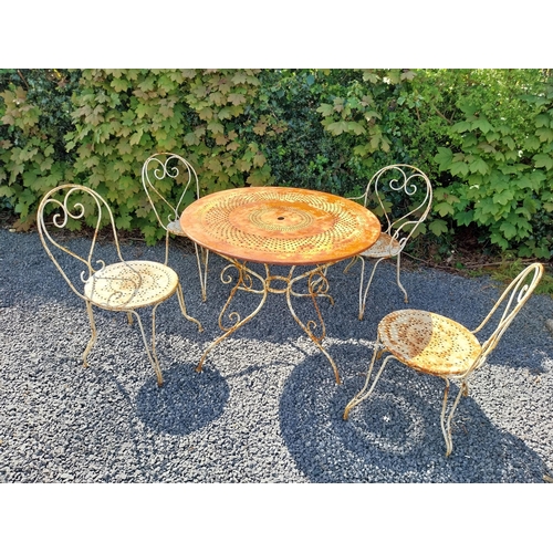 264 - Early 20th C. French wrought iron garden table with three matching chairs and one matching armchair ... 