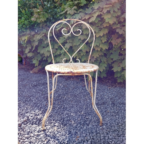 264 - Early 20th C. French wrought iron garden table with three matching chairs and one matching armchair ... 