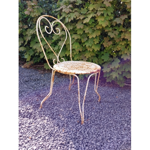 264 - Early 20th C. French wrought iron garden table with three matching chairs and one matching armchair ... 