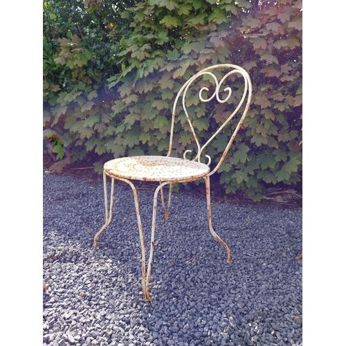 264 - Early 20th C. French wrought iron garden table with three matching chairs and one matching armchair ... 