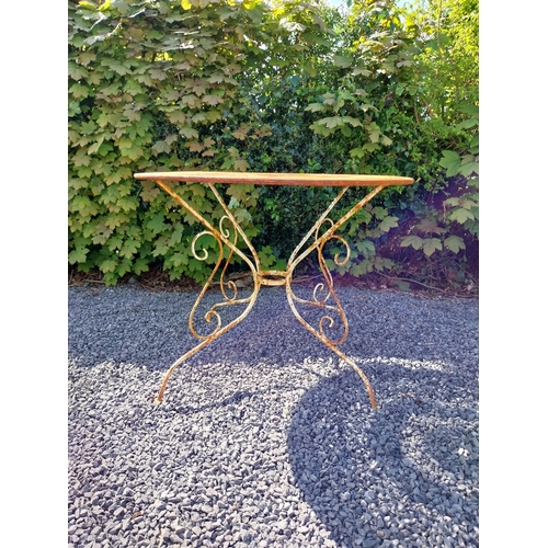 264 - Early 20th C. French wrought iron garden table with three matching chairs and one matching armchair ... 