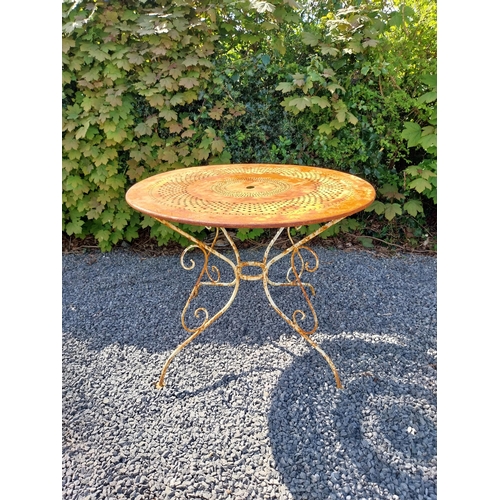 264 - Early 20th C. French wrought iron garden table with three matching chairs and one matching armchair ... 