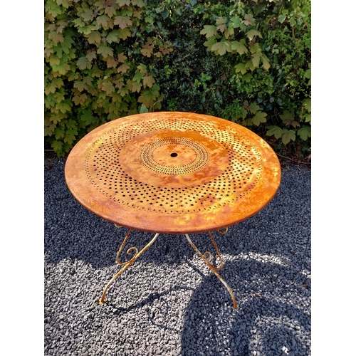 264 - Early 20th C. French wrought iron garden table with three matching chairs and one matching armchair ... 