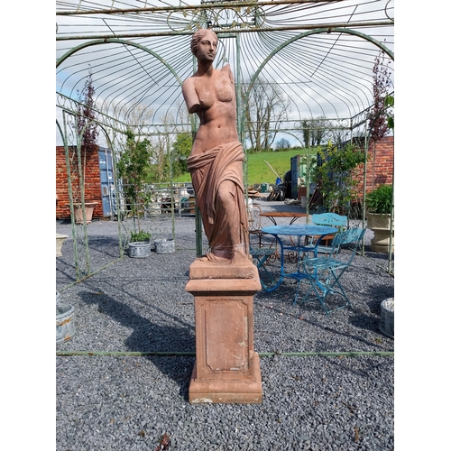 274 - Moulded terracotta Venus de Milo statue raised on pedestal {200 cm H x 47 cm W x 47 cm D}.