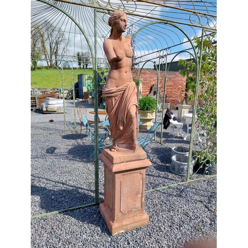 274 - Moulded terracotta Venus de Milo statue raised on pedestal {200 cm H x 47 cm W x 47 cm D}.