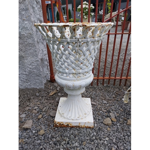 276 - Pair of good quality cast iron urns with lattice design {63 cm H x 43 cm Dia.}.