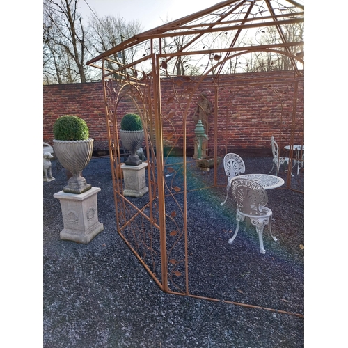 282 - Decorative wrought iron garden Gazebo with ivy leaf decoration. {320 cm H x 360 cm Diam}.